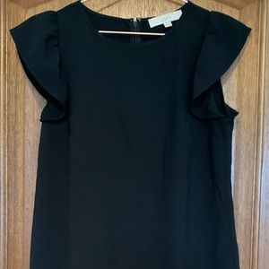 Black dress with ruffles. Looks adorable with cowboy boots!